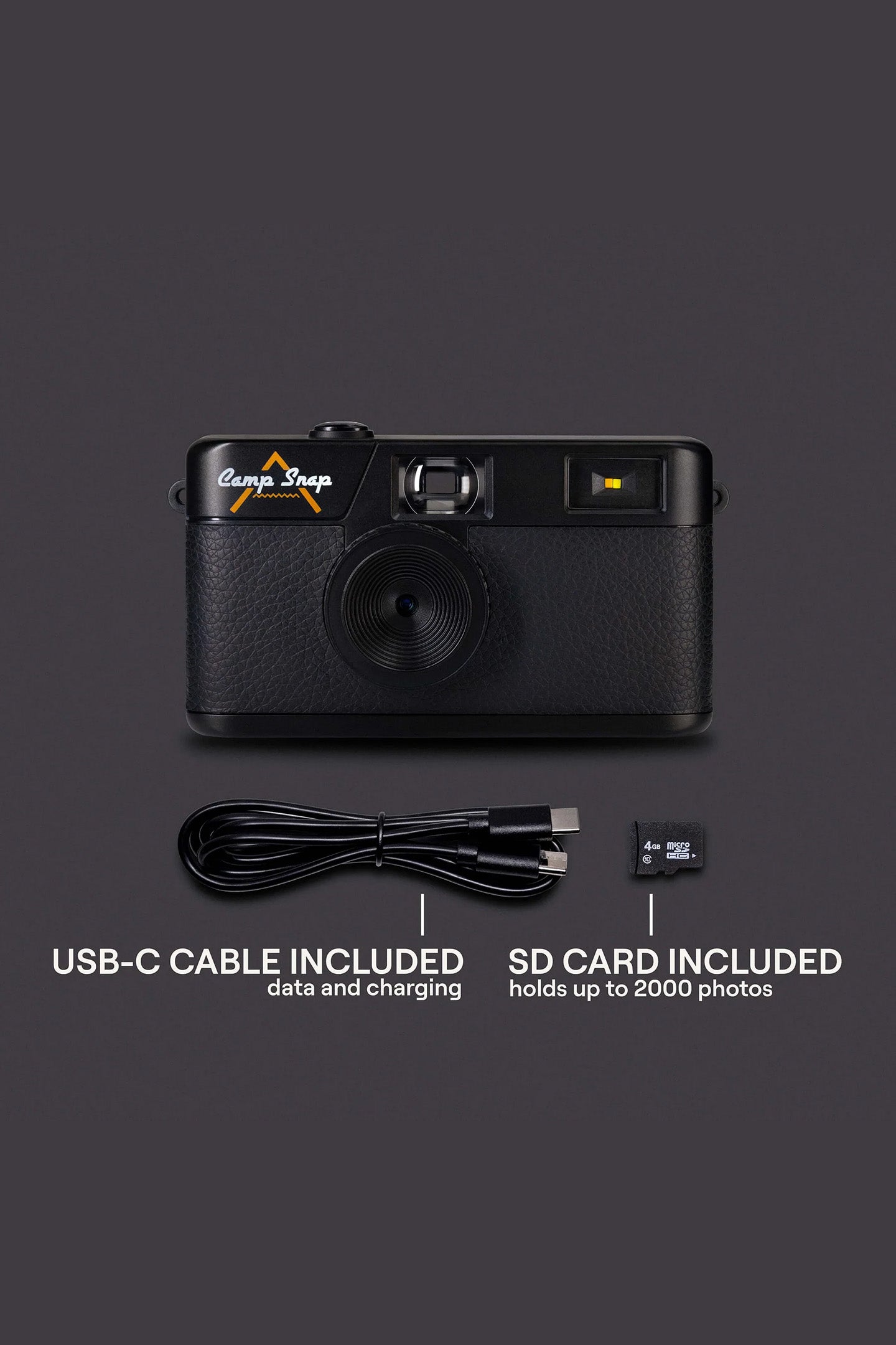 Black Camp Snap camera with USB-C cable and SD card on a dark background