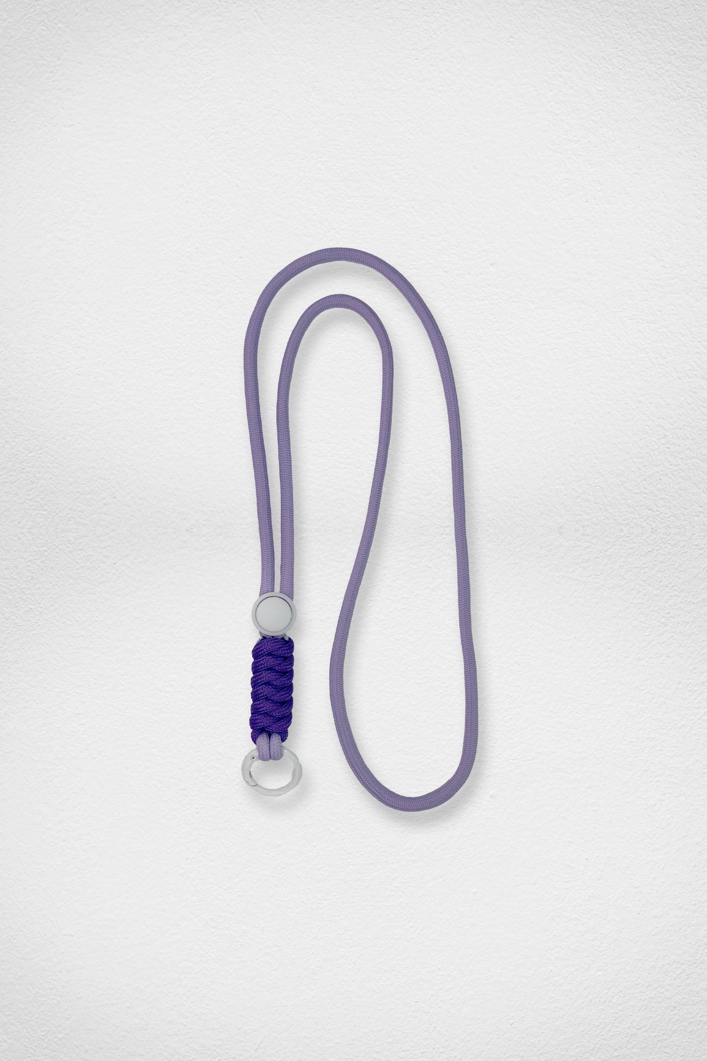 Purple lanyard with purple and white design on a light gray background