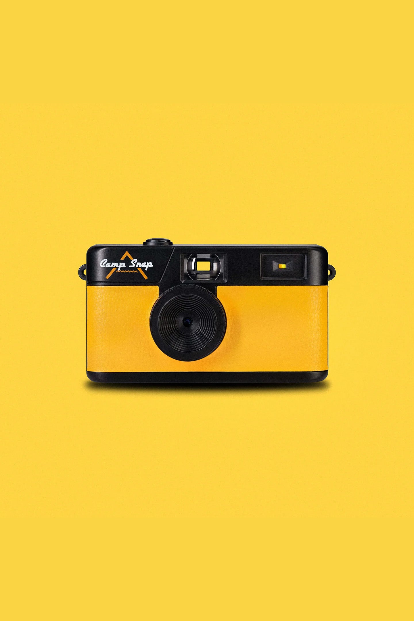 Yellow camp snap camera with black accents on a yellow background